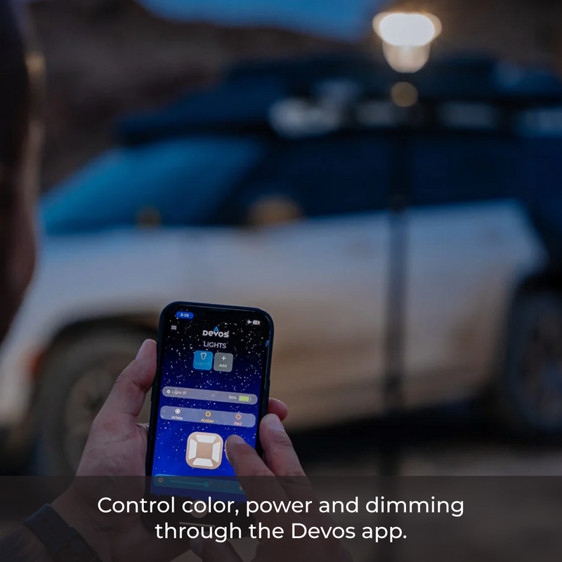 Load image into Gallery viewer, Using the Devos app to adjust LightRanger 2000 lighting settings outdoors—control color, brightness, and power with your phone.
